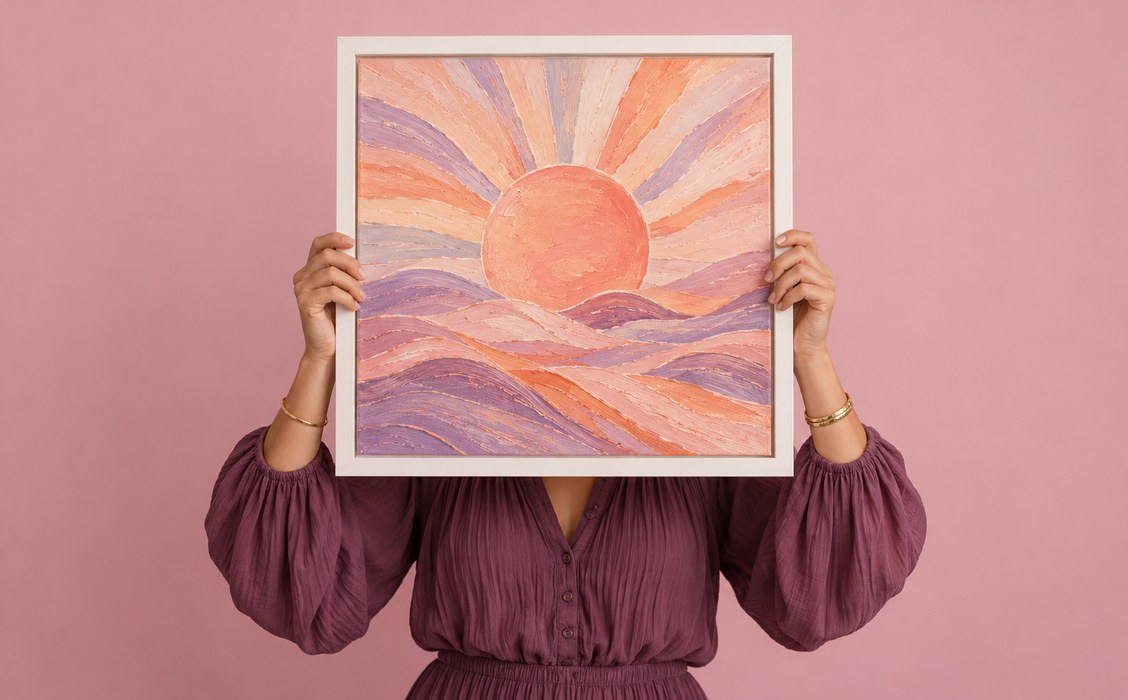 An artist holding a framed abstract album artwork